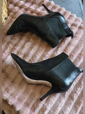 MICHAEL Michael Kors leather ankle booties in black.